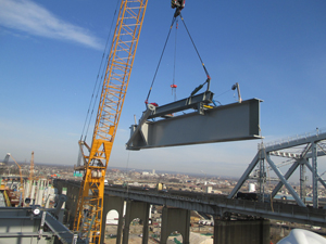 Beam lifted with crane using hydraulic manipulator